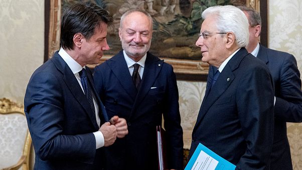 Italy's president swears in new populist coalition government Italy's president swears in new populist coalition government