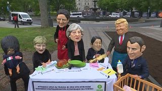Oxfam urges G7 leaders to tackle women's inequality with "Big Heads" protest