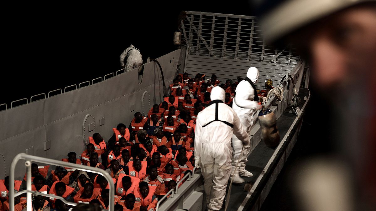 Rescued migrants to be transferred from overloaded ship for voyage to Spain