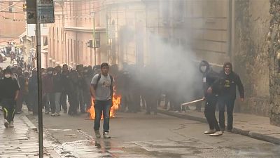 Tear gas, rockets fly as Bolivian students clash with police