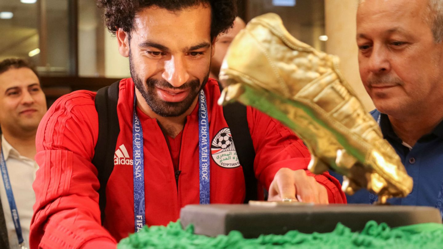 Mo Salah poses with Mo Salah cake as he celebrates his 31st birthday