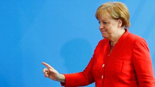 Macron reçu par Merkel sur fond de crise migratoire