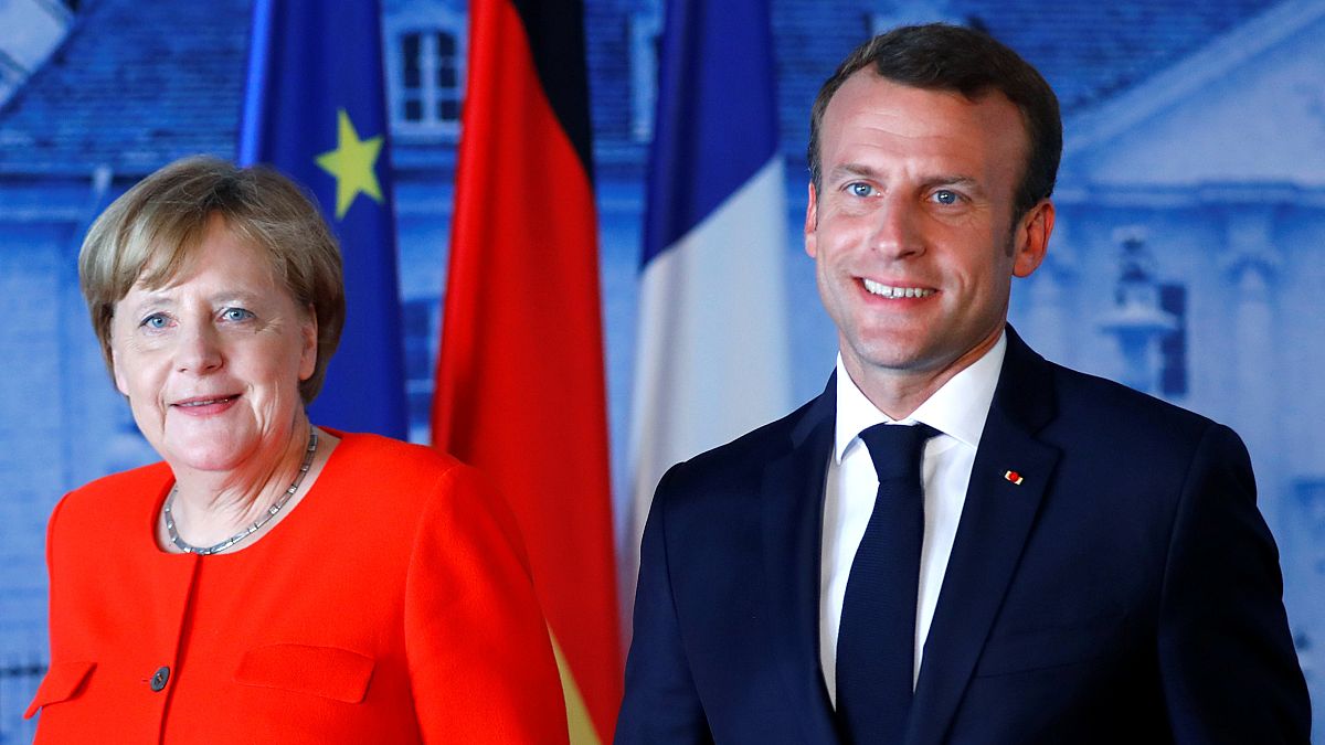 German Chancellor Angela Merkel welcomes French President Emmanuel Macron 