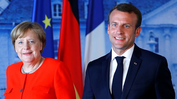 German Chancellor Angela Merkel welcomes French President Emmanuel Macron German Chancellor Angela Merkel welcomes French President Emmanuel Macron