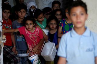 Benetton criticised for using pictures of migrants in adverts