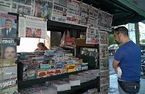 Greek newspapers carrying news of the debt relief deal