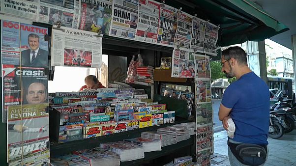Greek newspapers carrying news of the debt relief deal Greek newspapers carrying news of the debt relief deal