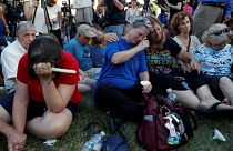 Tearful mourners at the vigil for the victims