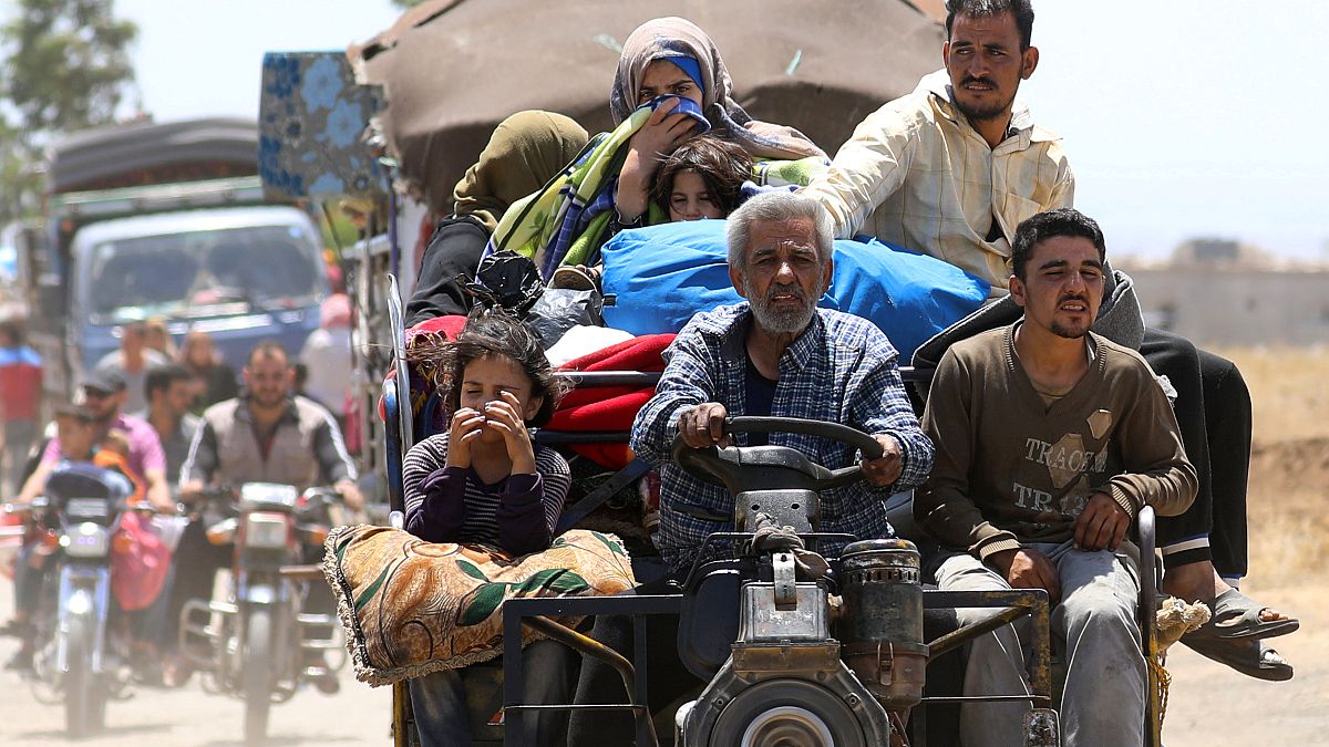 Civilians seeking safety near Daraa in southern Syria