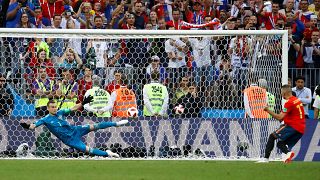 Last 16: Russia's Igor Akinfeev saves a penalty from Spain's Iago Aspas