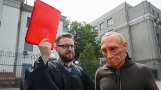 Activists stage a performance in front of the Russian embassy in Kyiv