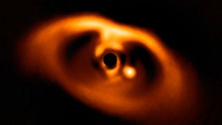 Giant telescope captures first-ever snapshot of a newborn planet