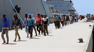 Migrants arrive in Tripoli after being rescued by Libyan coast guards.