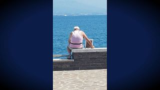 This Italian widower goes to the sea every morning with a framed picture of his late wife