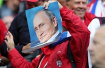 Where's Putin? Serbia fan holds a photo of the Russian leader at World Cup