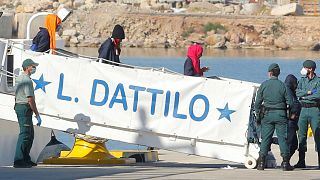 Italian coast guard intervenes in migrant rescue 'to save crew'