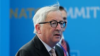 Juncker seen stumbling before NATO gala dinner, leaders step in to help