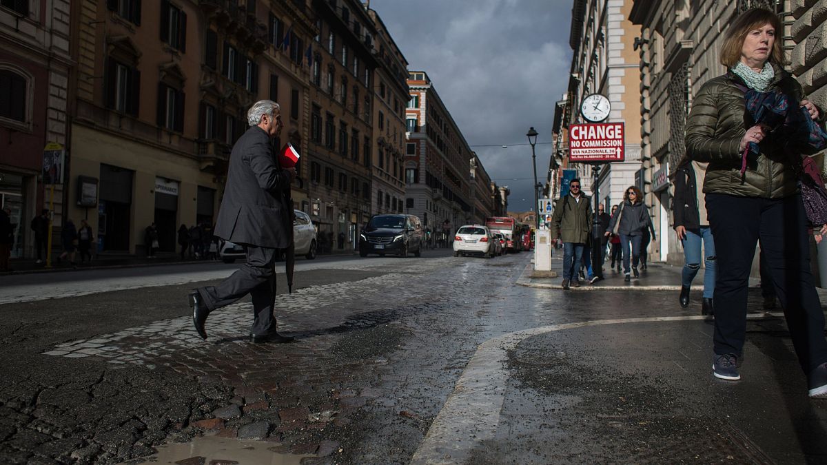 Rome residents paint potholes to alert cyclists and shame authorities after woman's death