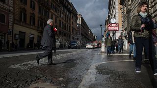 Rome residents paint potholes to alert cyclists and shame authorities after woman's death