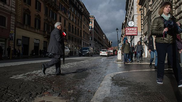 Rome residents paint potholes to alert cyclists and shame authorities after woman's death Rome residents paint potholes to alert cyclists and shame authorities after woman's death