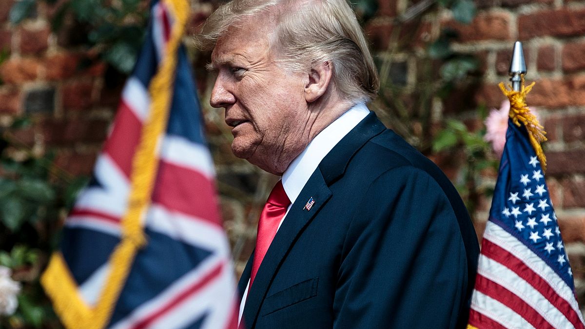 Donald Trump heads to a meeting with Theresa May in Britain on July 13