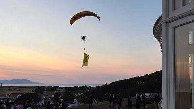 Trump 'well below par': paragliding protester flies over Scotland resort