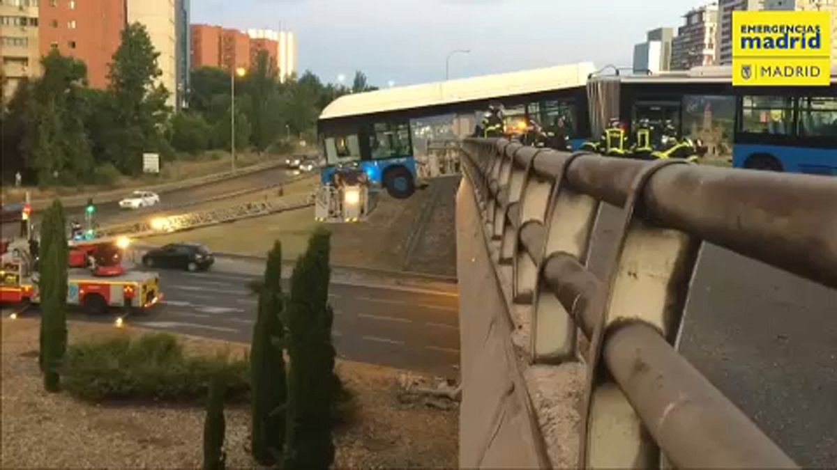 bus is hanging from the bridge in Madrid 