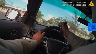 Watch: Officer fires through window in Las Vegas car chase