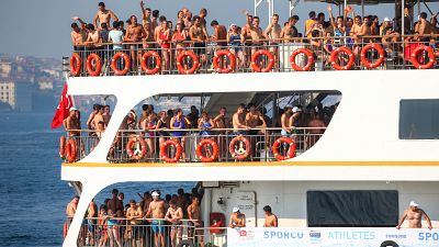 Swimmers race from Asia to Europe across Turkey's Bosphorus Strait