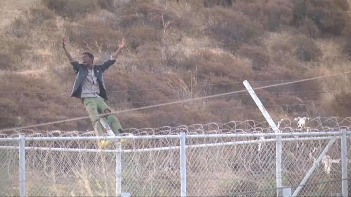 Migrants storm fence at Spain's Ceuta enclave 