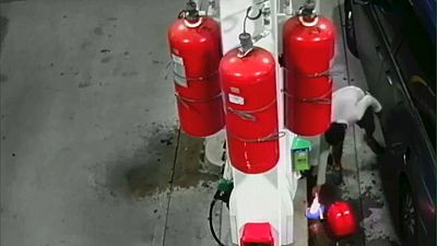 CCTV shows man sparking gas station fire
