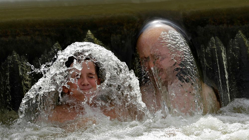 In pictures: Trying to keep cool in Europe’s heatwave