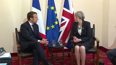 Theresa May tries to sell Brexit to Macron
