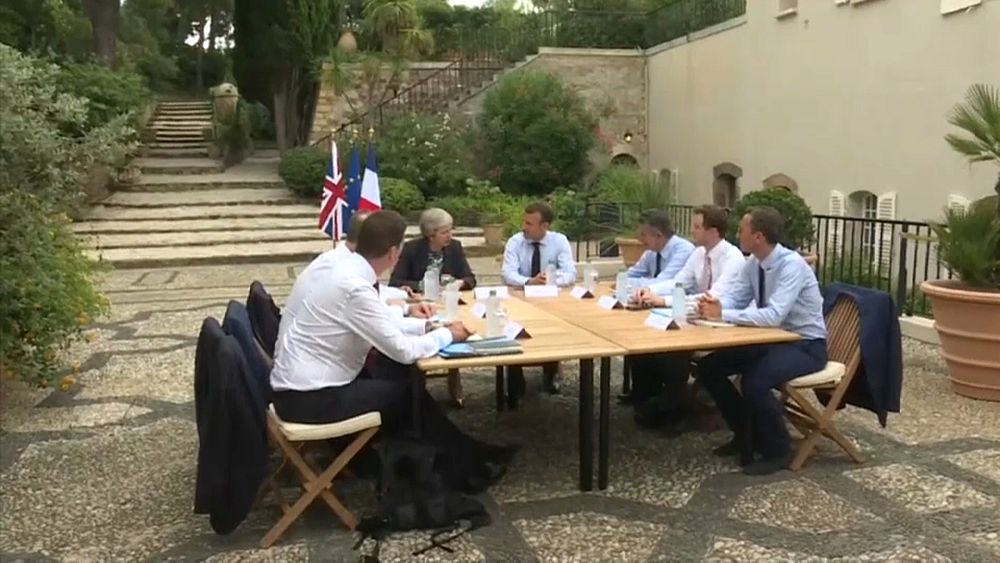 Working holiday: Macron meets May for Brexit talks at his summer residence