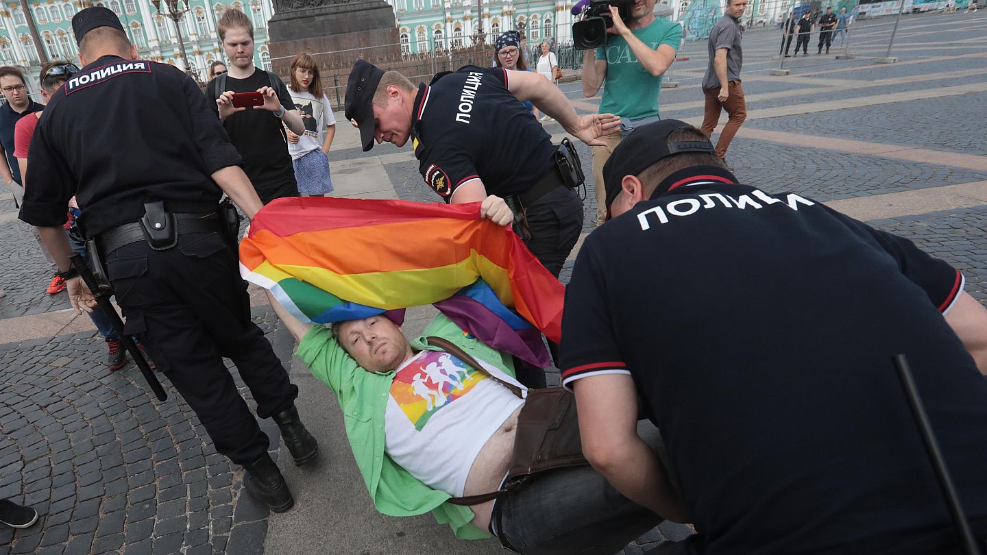man arrested burning gay flag
