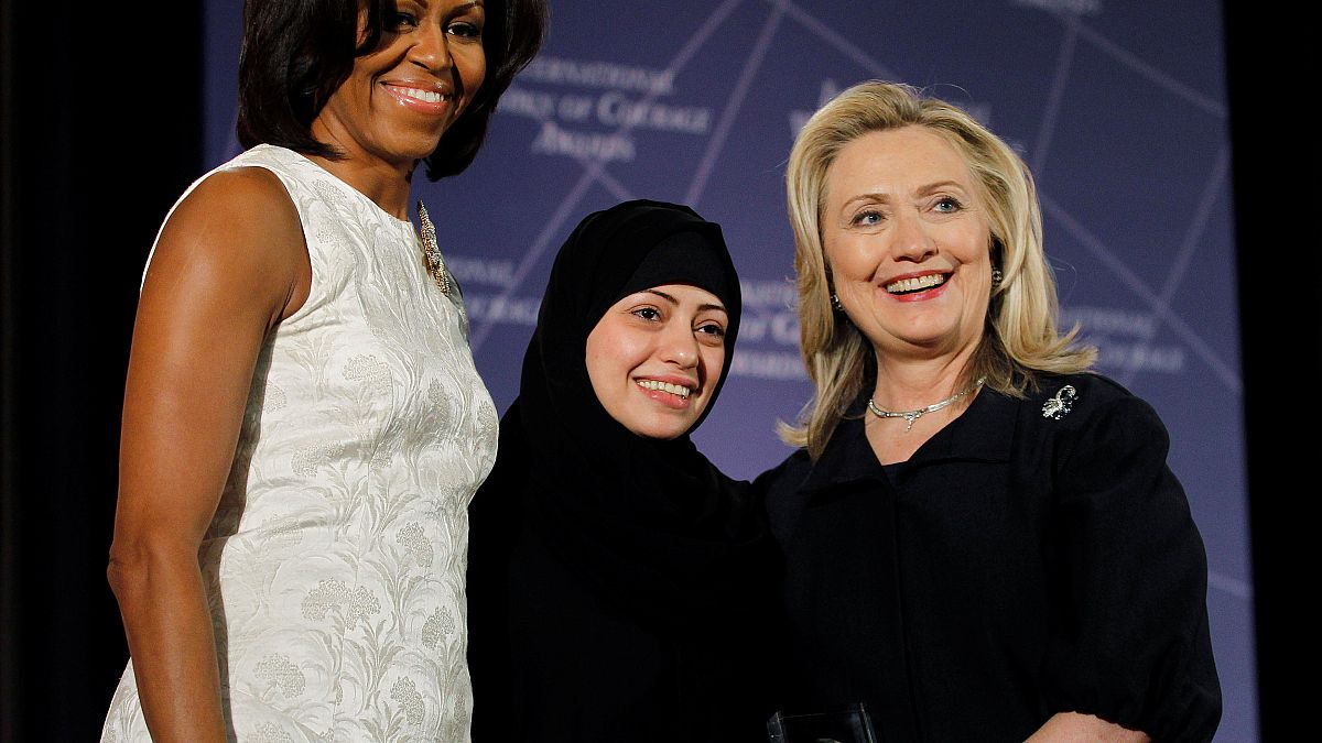 Samar Badawi pictured with Michelle Obama and Hillary Clinton