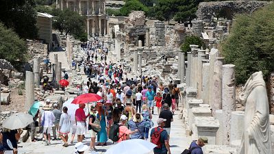 Tourists visit the ancient city of Ephesus near Izmir in Turkey