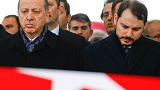 Erdogan challenges economy 'game-players' as currency plummets