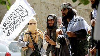 Taliban walk as they celebrate ceasefire in Ghanikhel district of Nangarha