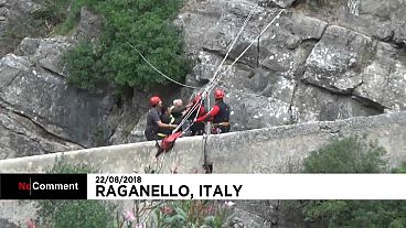 Watch: Rescuers in Italy search for survivors of flash flood 