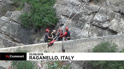 Watch: Rescuers in Italy search for survivors of flash flood 