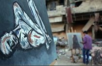 Watch: Syrian artists create colour amid ruins