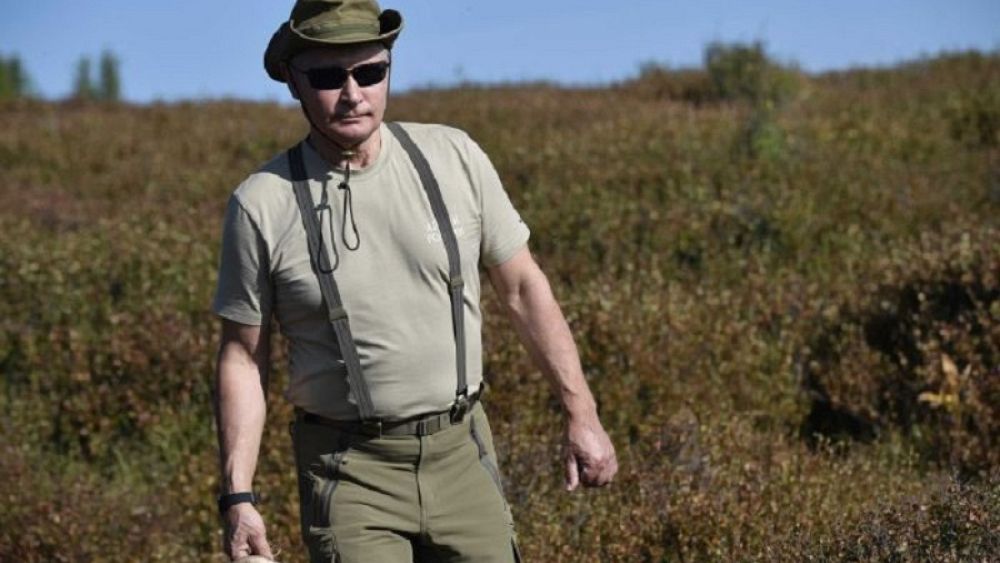 Watch: Russia's Putin enjoys the great outdoors as he hikes in Siberia with top officials