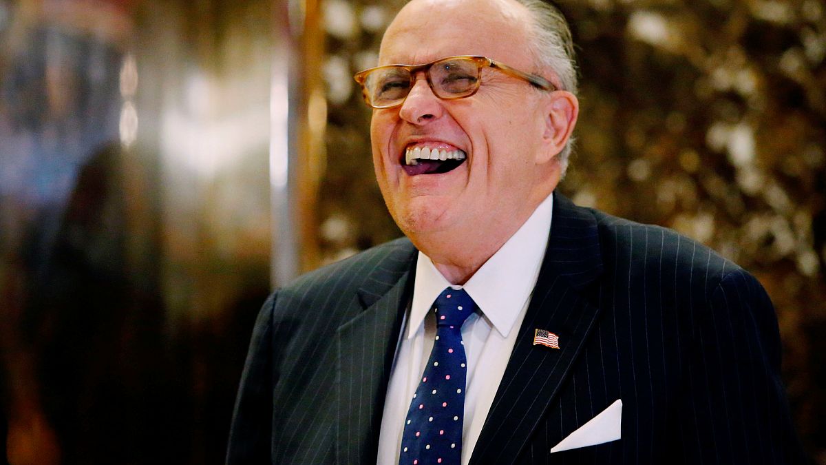 Why is Rudy Giuliani attacking the Romanian president?