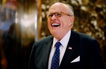 Why is Rudy Giuliani attacking the Romanian president?