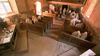 Haunting memory - tourists flock to ghostly church
