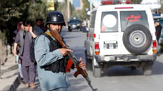 An Afghan policeman near the site of a suicide bomb blast in Kabul.