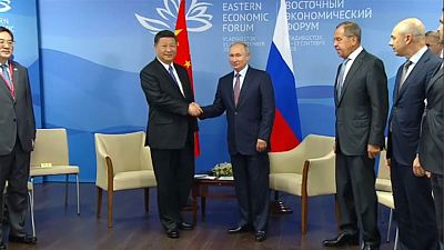 China urges Russia to work to oppose protectionism