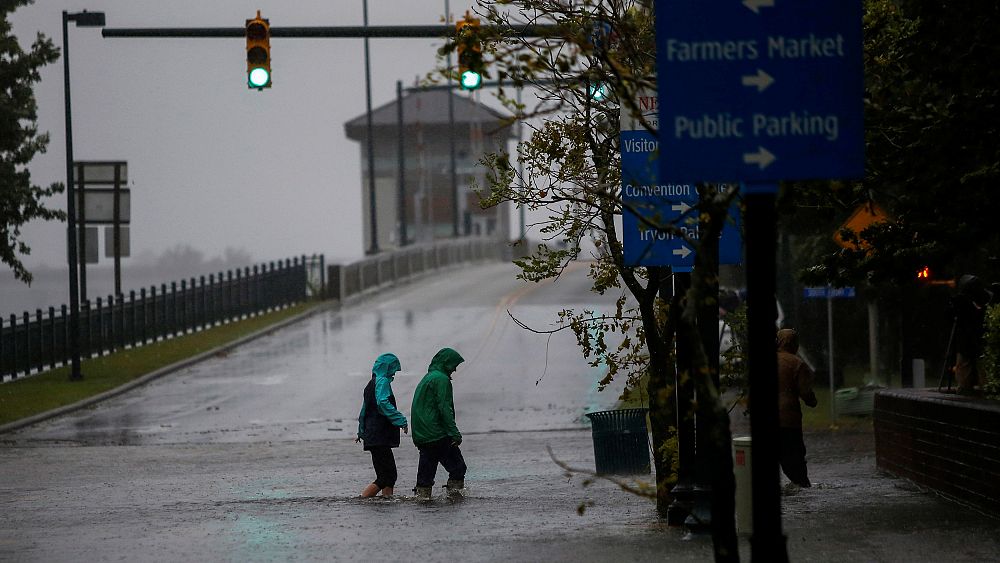 Five dead in tropical storm as flooding and surges continue on US East Coast
