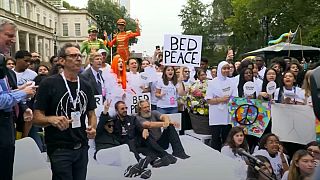 Students get perfect mix of bed and protest in Lennon-inspired NYC event